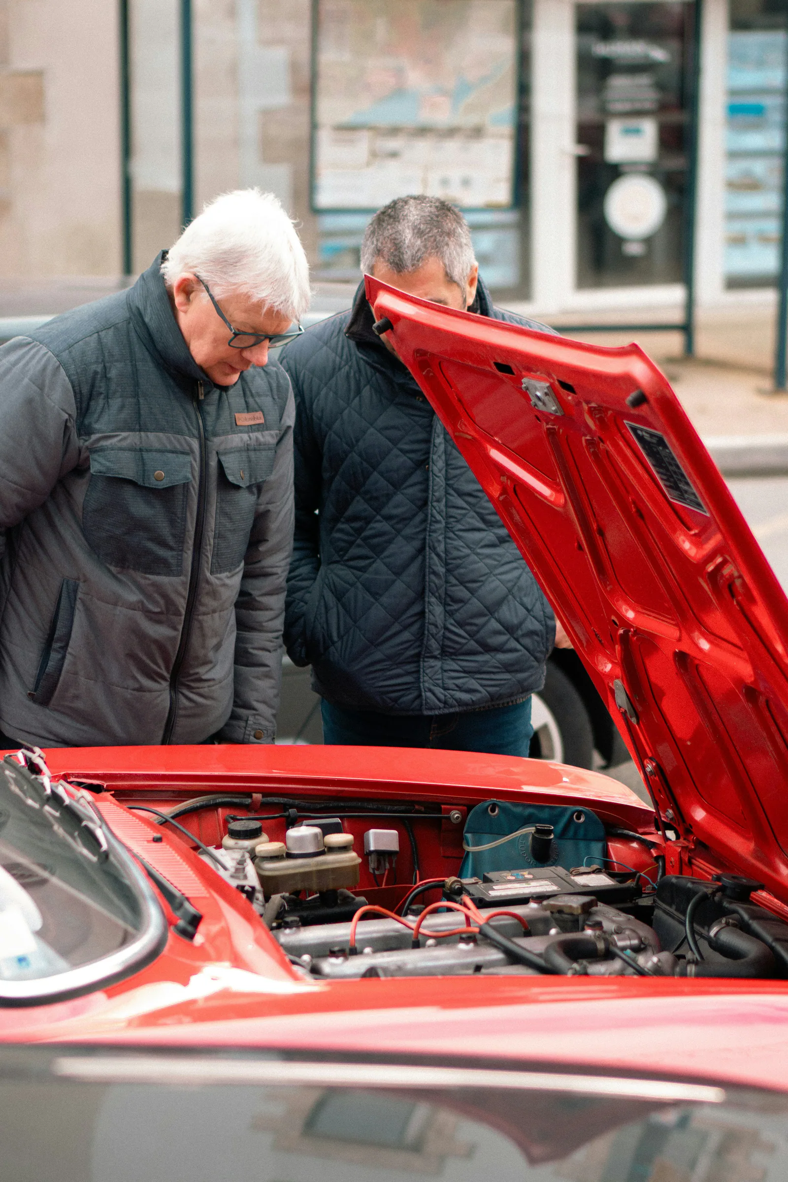 Auto repair technician explaining vehicle issues to a customer