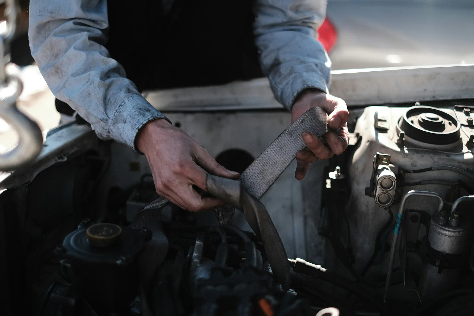 A mechanic checking a car's AC system