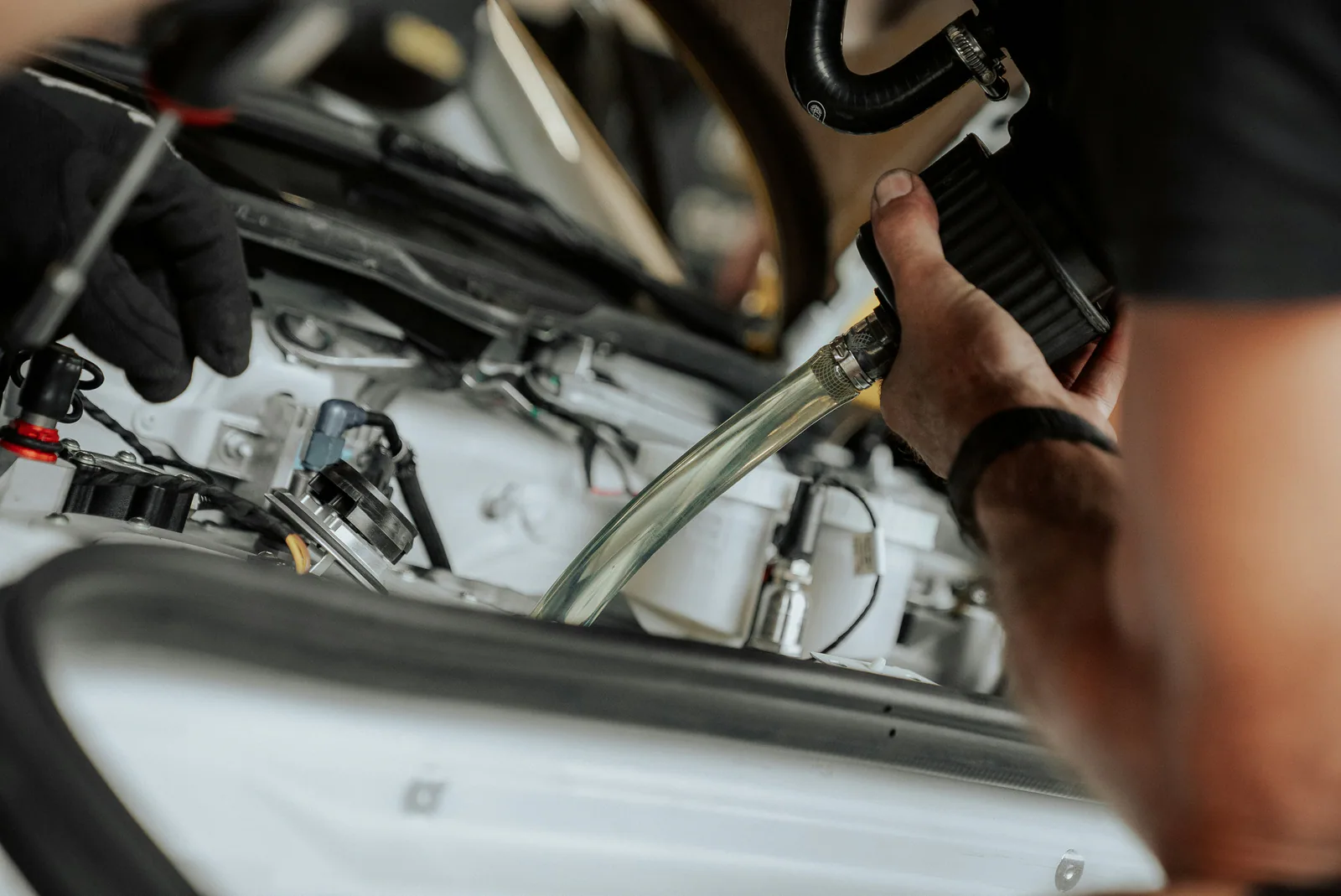 Technician performing car AC repair